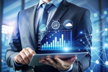 businessman using tablet with digital graphics.